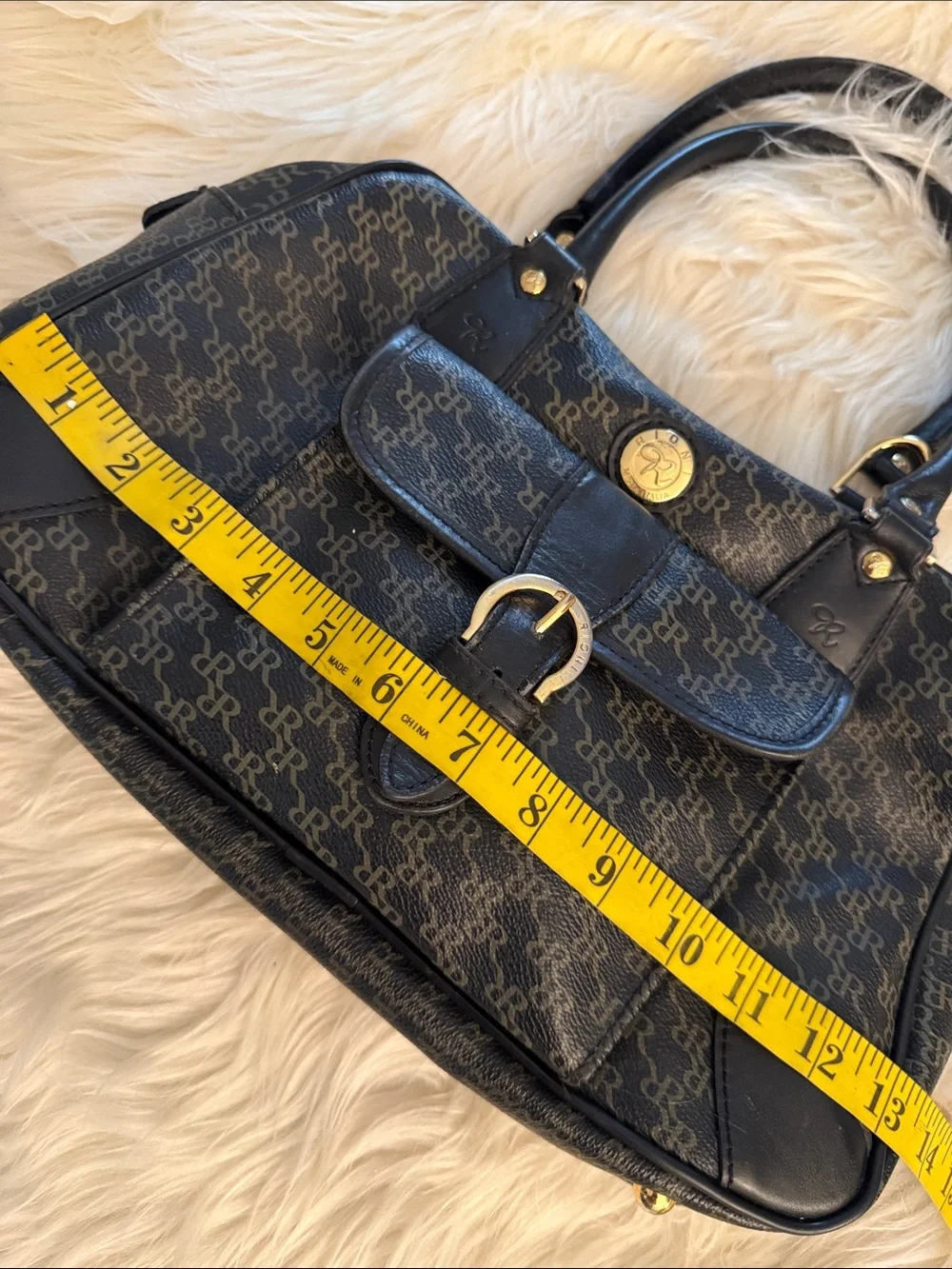 Rioni Signature Organizer Satchel featuring a black monogram 
